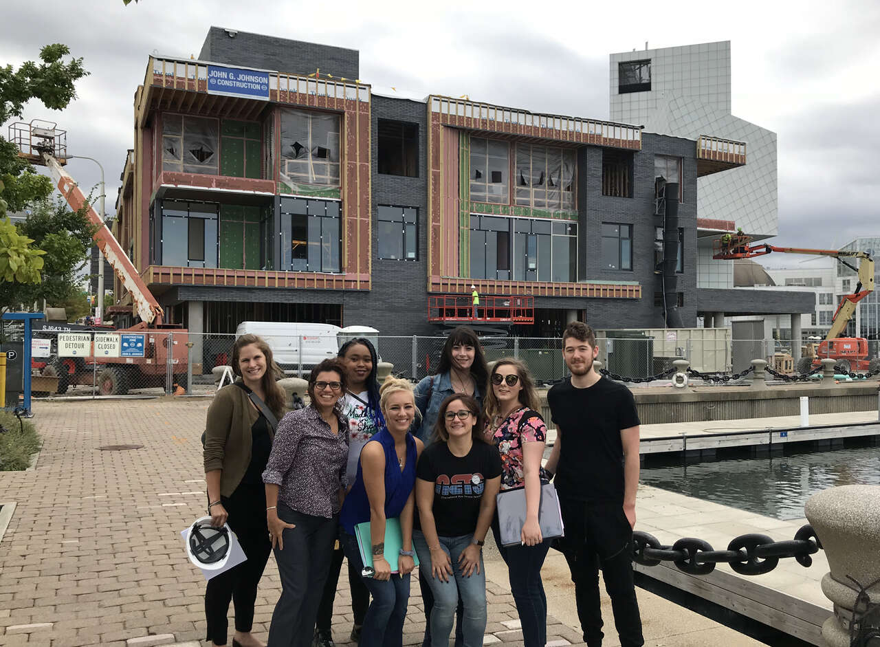 Students outside of Harbor Verandas which is under construction