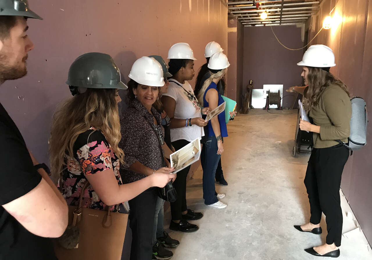 Students in a hallway that is under construction at Harbor Verandas